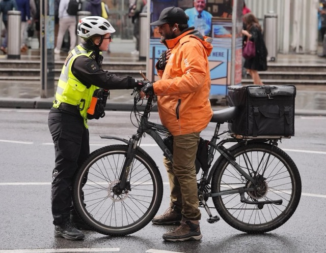 15476_a-police-officer-stopping-an-electric-bike Medium.jpg